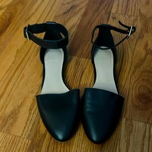 Black single ankle strap flats